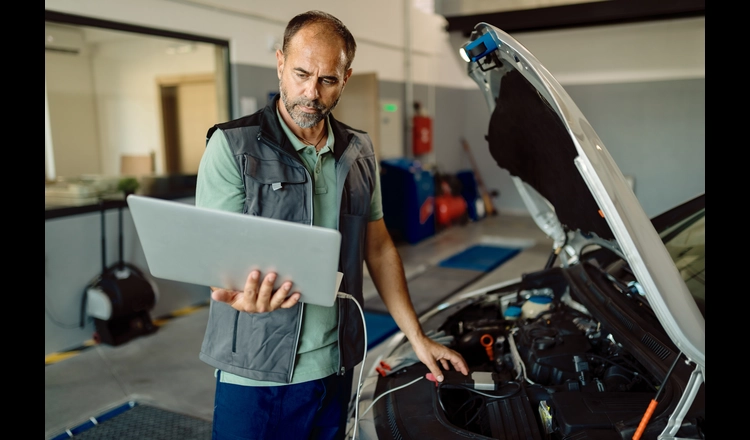 garage management software dashboard showing job cards, inventory, and invoicing for auto repair shop